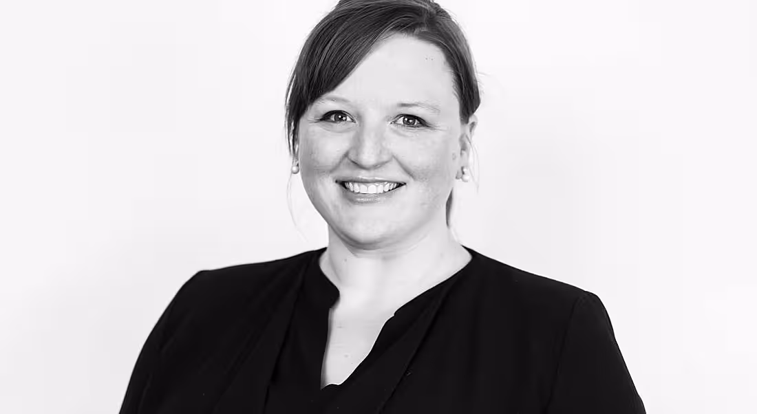 A black and white headshot of Sarah Winton.