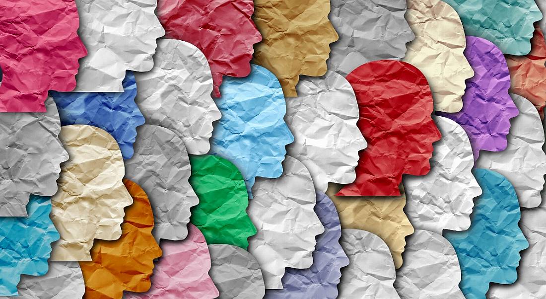 Illustration of different coloured paper heads laid out across each other.