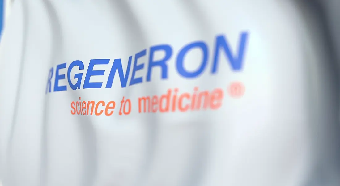 Waving flag with Regeneron logo.