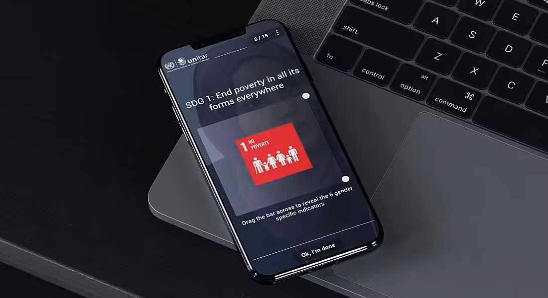 EdApp graphic on a smartphone resting on a laptop against a dark background.