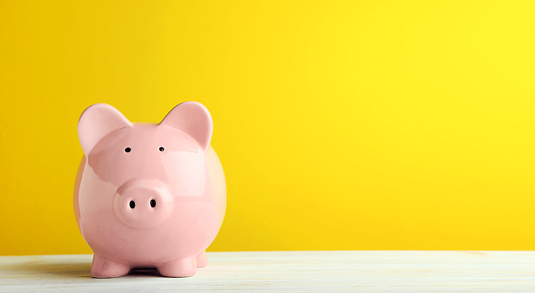 A piggy bank in front of a yellow background.