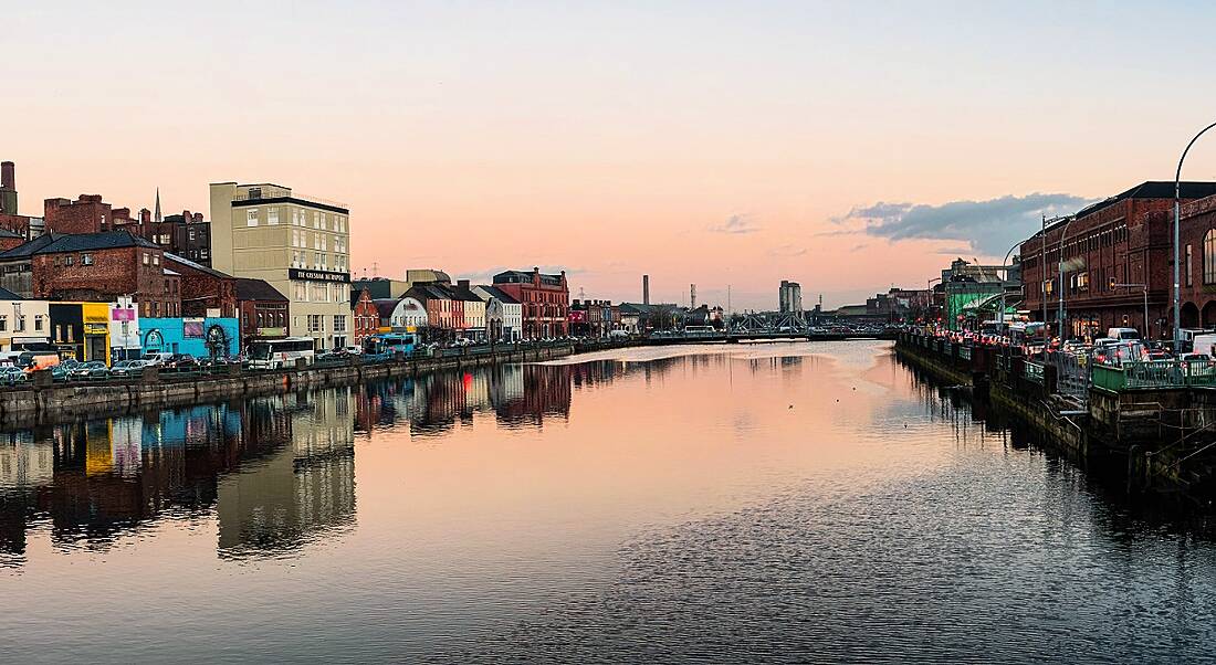 The River Lee in Cork city against an evening sky as the sun is setting.