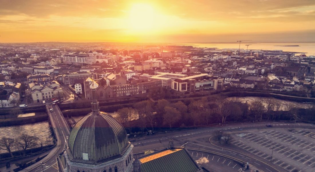 Aerial view of Galway city at sunrise over Galway Cathedral.