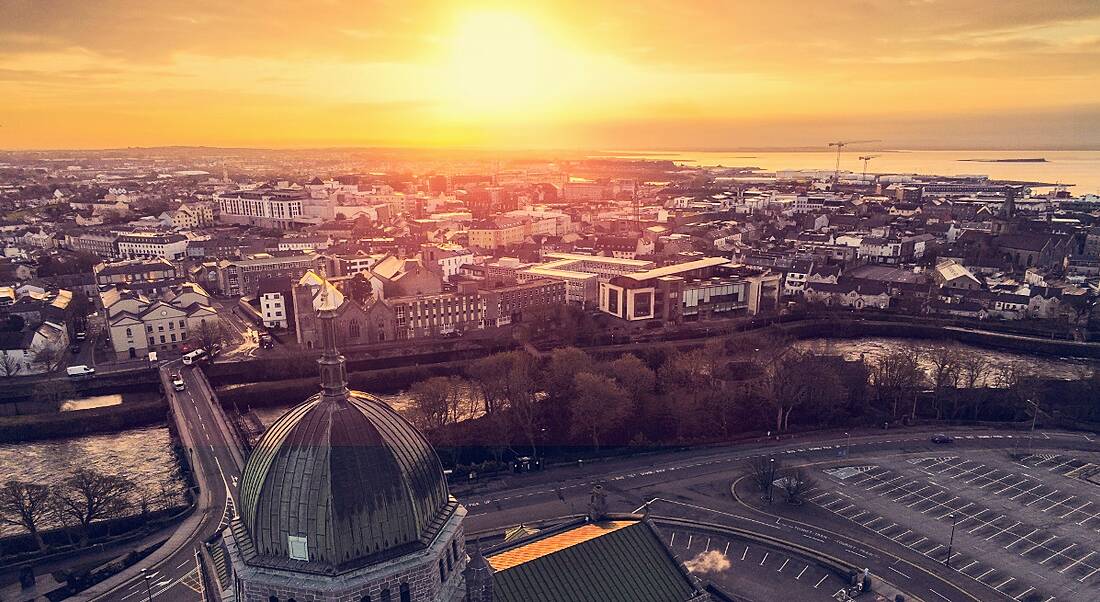 Aerial view of Galway city at sunrise over Galway Cathedral.