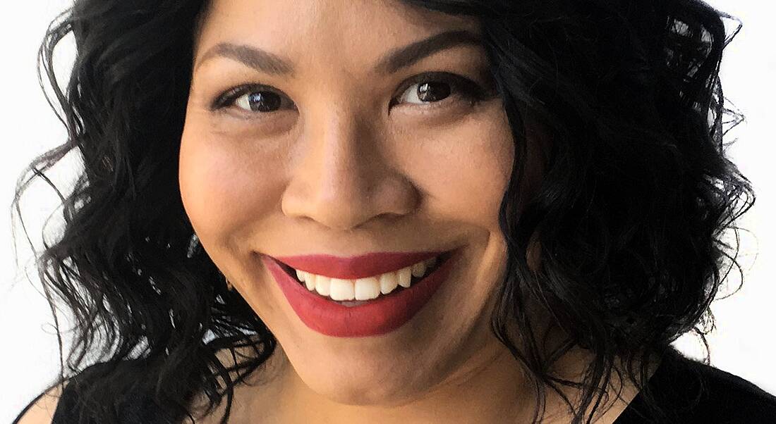 A close-up image of Cheryl Contee, a woman with dark hair and bright red lipstick.