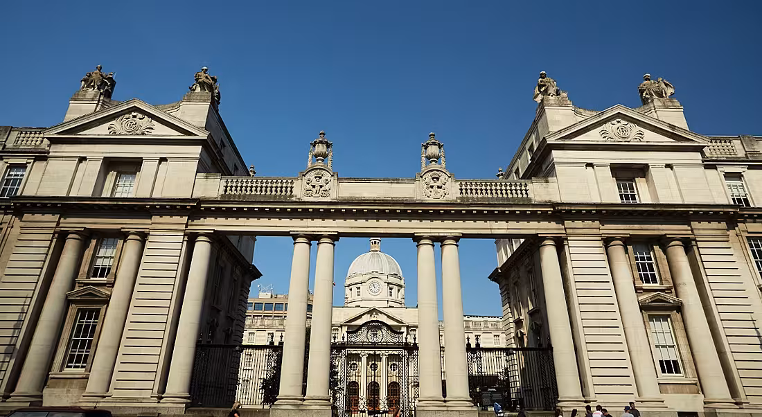 View from the street looking up to the top of Leinster House against a dark but clear sky.