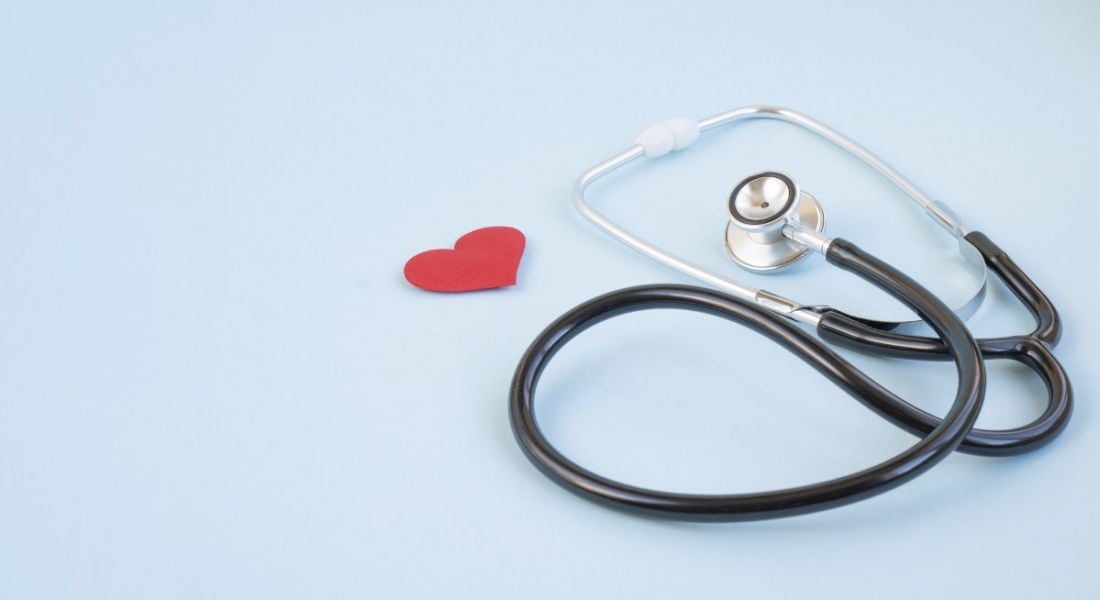 Stethoscope and red heart on a blue background.