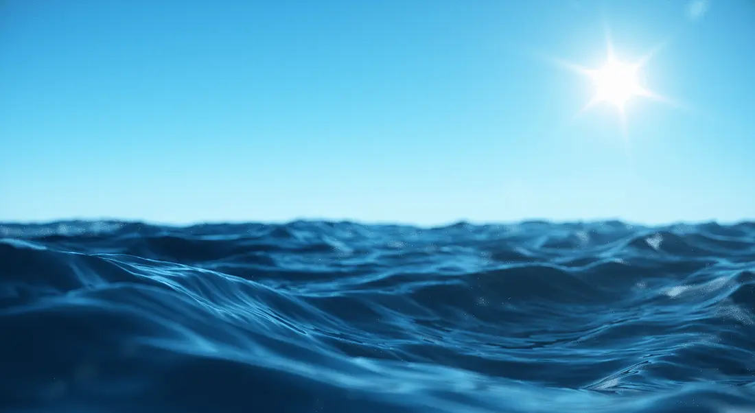 Dark blue water under a clear blue sky.