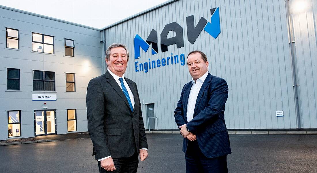 Two professional men are standing outside the MAW Engineering offices in Antrim, looking into the camera.