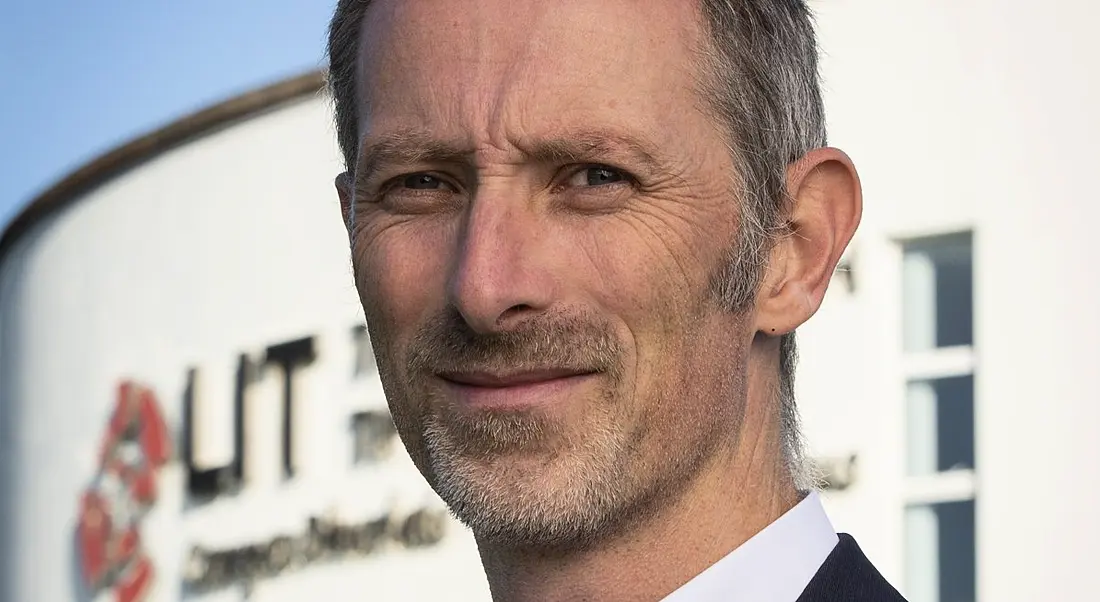 Energy research development manager Seamus Hoyne is smiling into the camera against a clear blue sky.