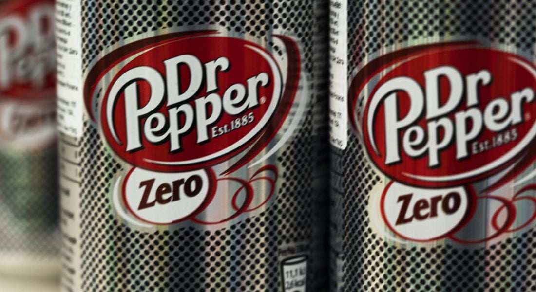Two cans of Dr Pepper Zero soft drinks in a store.