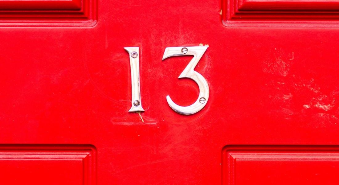 Number 13 on a bright red door.