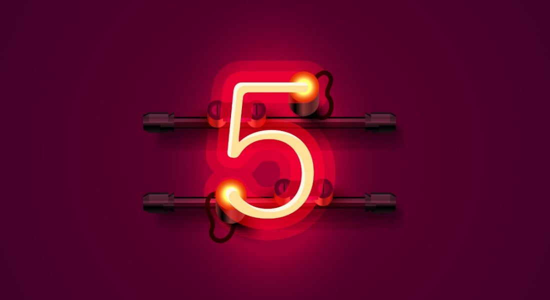 A lit up number 5 against a dark red background.