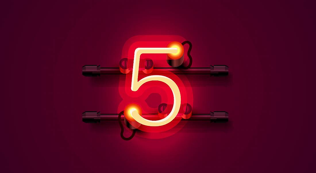 A lit up number 5 against a dark red background.