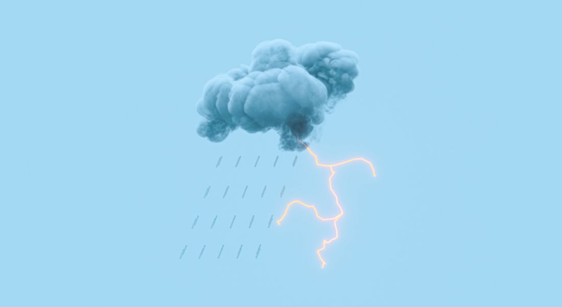Dark storm cloud with lightning against a blue background.
