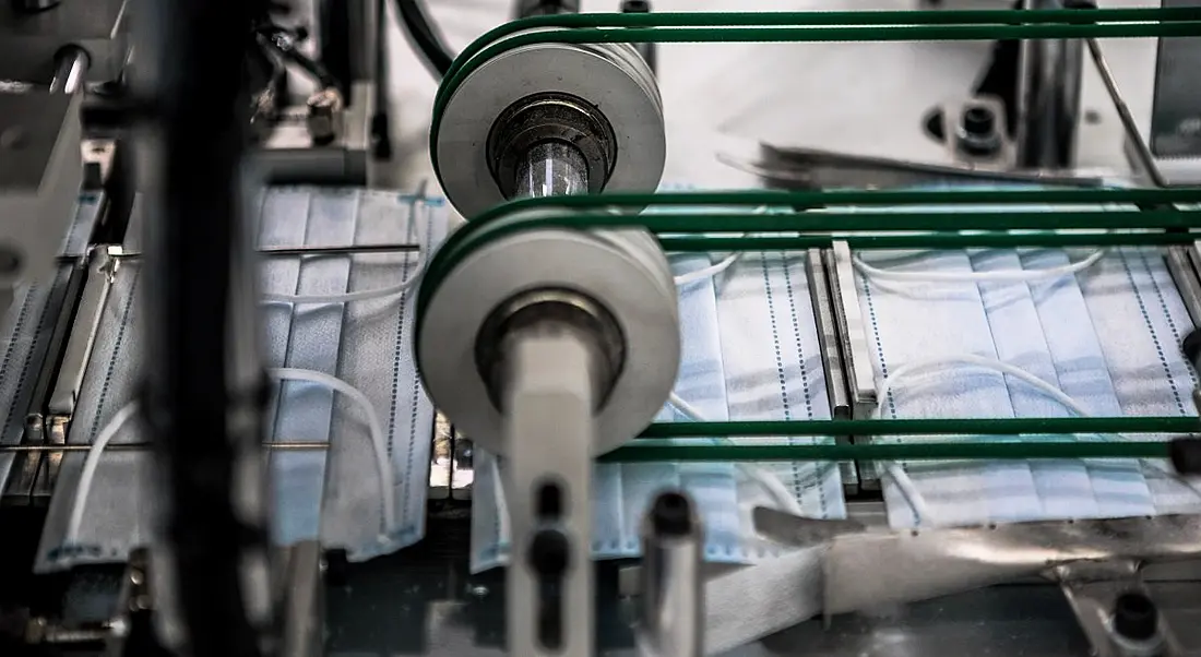 Surgical masks on a production line.