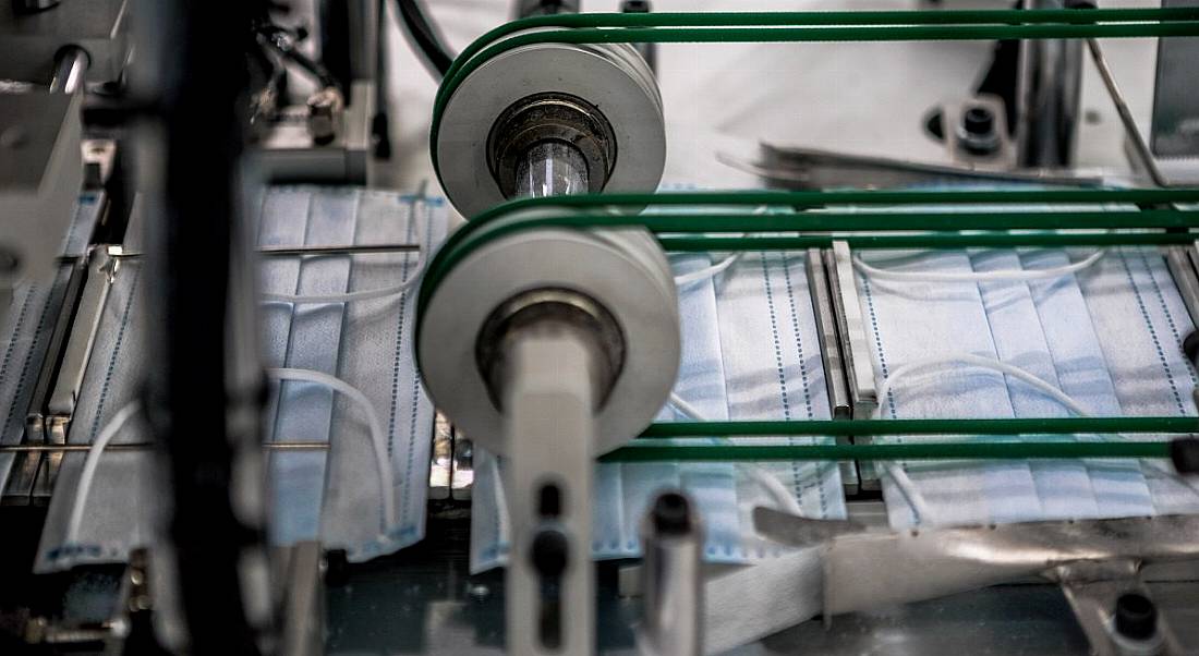 Surgical masks on a production line.