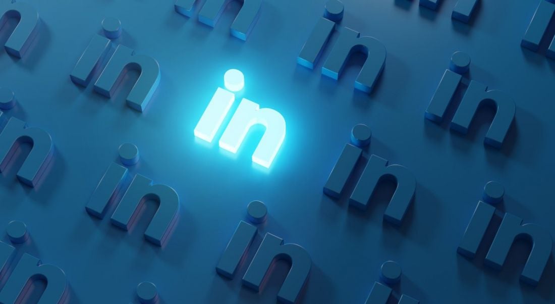 LinkedIn logo repeated across a dark blue background with one logo lit up.