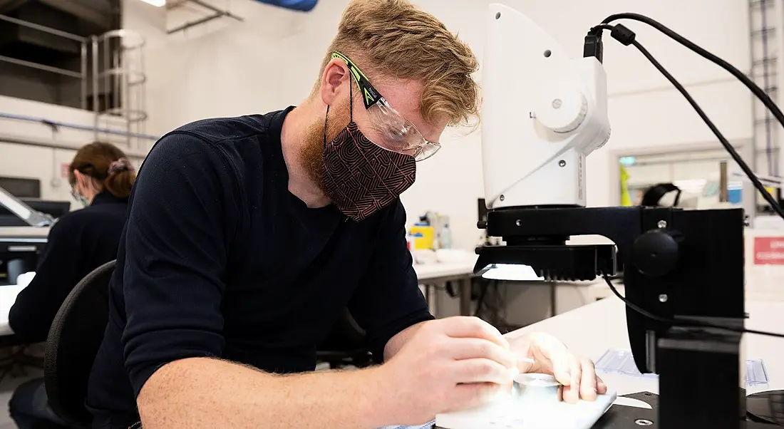 A man working in a medical device manufacturing facility.