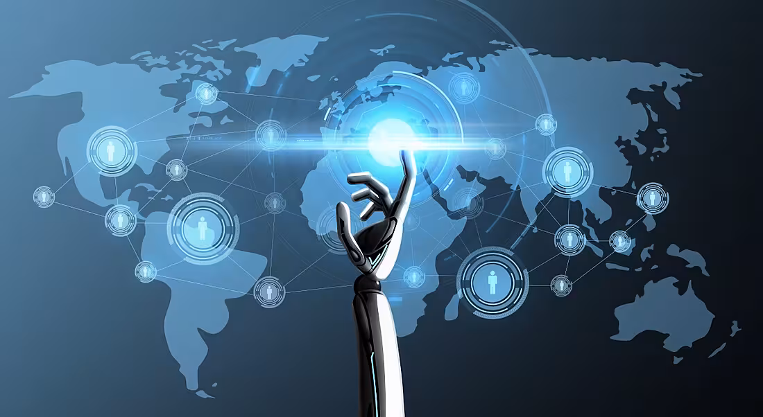 A robotic hand reaching up to point its index finger at a map of the world in light blue laid out on a dark blue background.
