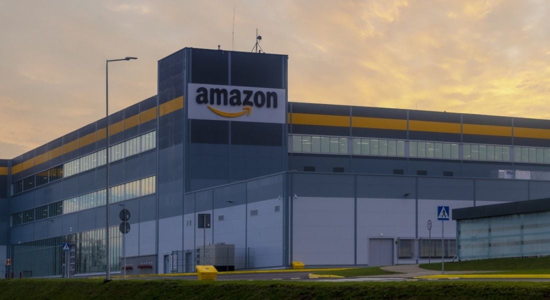 The exterior of one of Amazon's buildings bearing the company's logo.