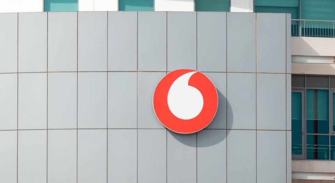 Photograph of an office building with the Vodafone logo on the front.