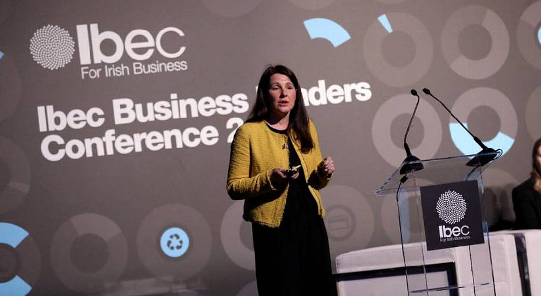 Karen O'Regan of Accenture Ireland is delivering a talk on stage at an IBEC event.