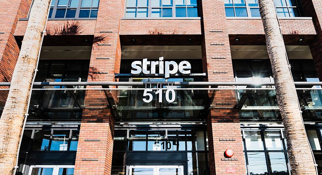 The Stripe logo over the entrance of a red-brick building in San Francisco.