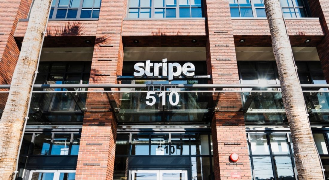 The Stripe logo over the entrance of a red-brick building in San Francisco.