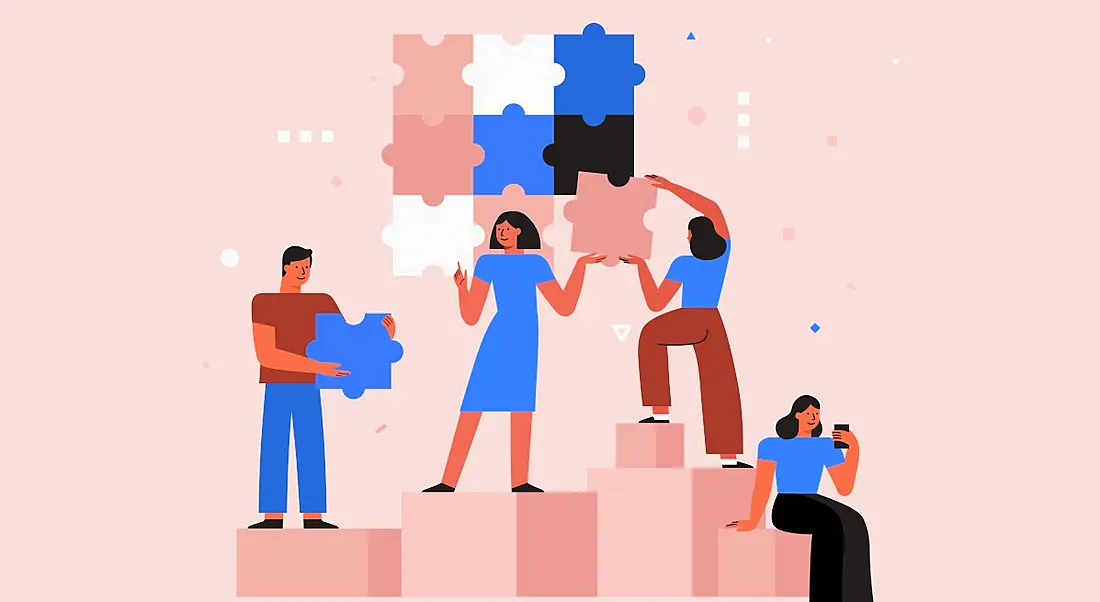 Illustration of a team working together with jigsaw pieces on a pink background, symbolising teamwork and collaboration tools.