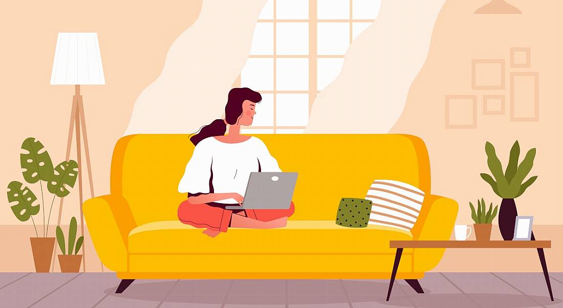 Illustration of a woman staying productive while working from home on a couch in front of a window and beside plants.