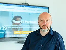 Virtual event set-up tech in an empty TV studio room.