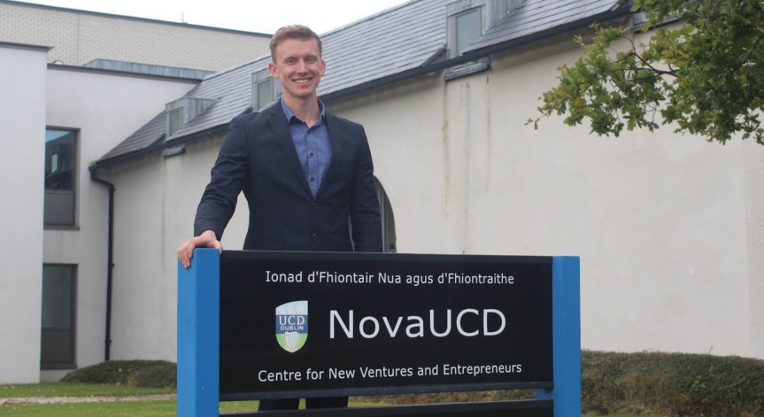 Founder and CEO of ReaDI-Watch David Byrne standing outside behind a low sign for NovaUCD.