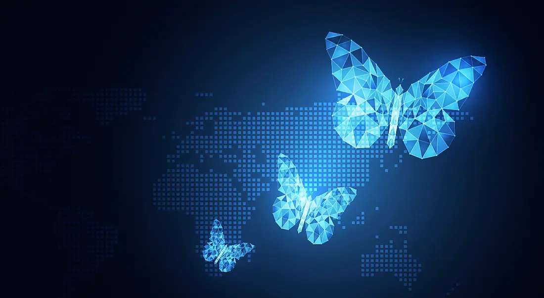 A digital rendering of three pixelated butterflies of different sizes against a pixelated image of a map of the world.