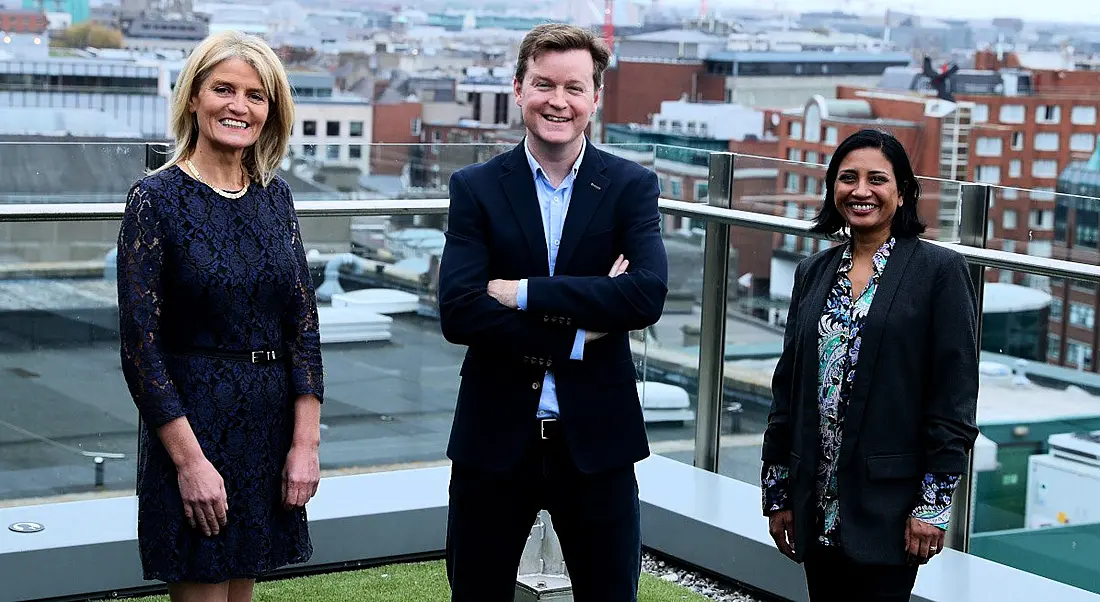 Mary Buckley, executive director of IDA, with Colm O'Cuinneain of Greenhouse and Renu Jhugaroo of Greenhouse on the roof of an office overlooking Dublin's city centre.