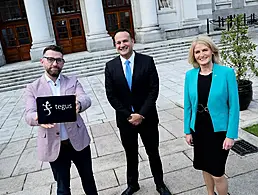 Mary Buckley, executive director of IDA, with Colm O'Cuinneain of Greenhouse and Renu Jhugaroo of Greenhouse on the roof of an office overlooking Dublin's city centre.