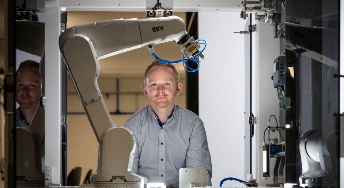 Noel Horgan in Kaon's Cork manufacturing facility surrounded by robotics arms and machines.
