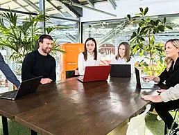 Mary Buckley, executive director of IDA, with Colm O'Cuinneain of Greenhouse and Renu Jhugaroo of Greenhouse on the roof of an office overlooking Dublin's city centre.