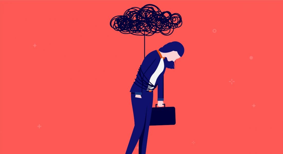 A cartoon image of a woman in business attire walking but slouched. There is a black cloud above her tied to her waist, symbolising brain fog.