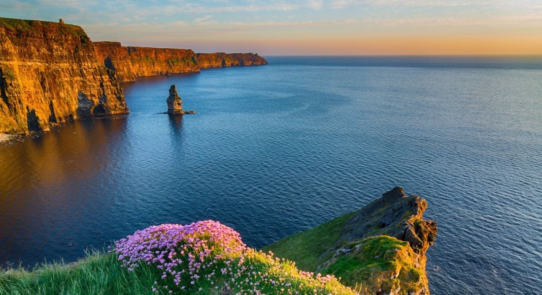 A scenic view of the Cliffs of Moher in Co Clare at sunset.