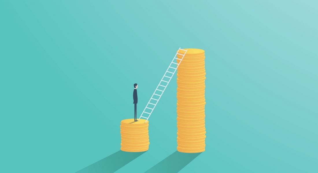 A cartoon image of a man standing on a stack of gold coins facing a ladder leading to a much higher stack of gold coins, symbolising a pay rise.