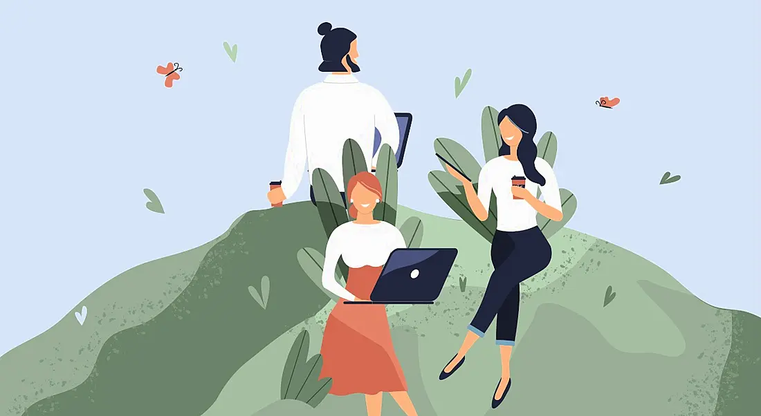 An animation of three workers with coffee and laptops sitting on a green lawn surrounded by butterflies, symbolising workplace wellness.