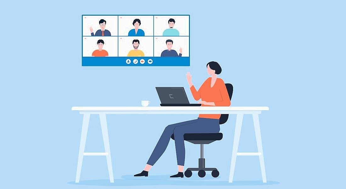 A cartoon image of a woman remote working at a desk. Above her is a screen that shows six people in a virtual meeting.