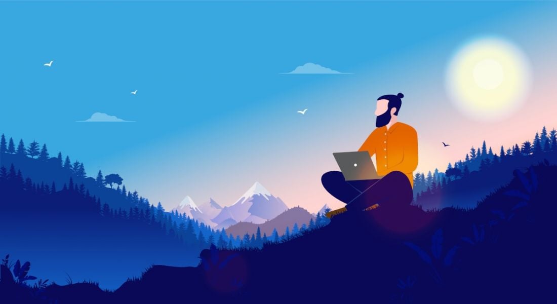 A cartoon of a man, working at his laptop while sitting on a remote mountainside.