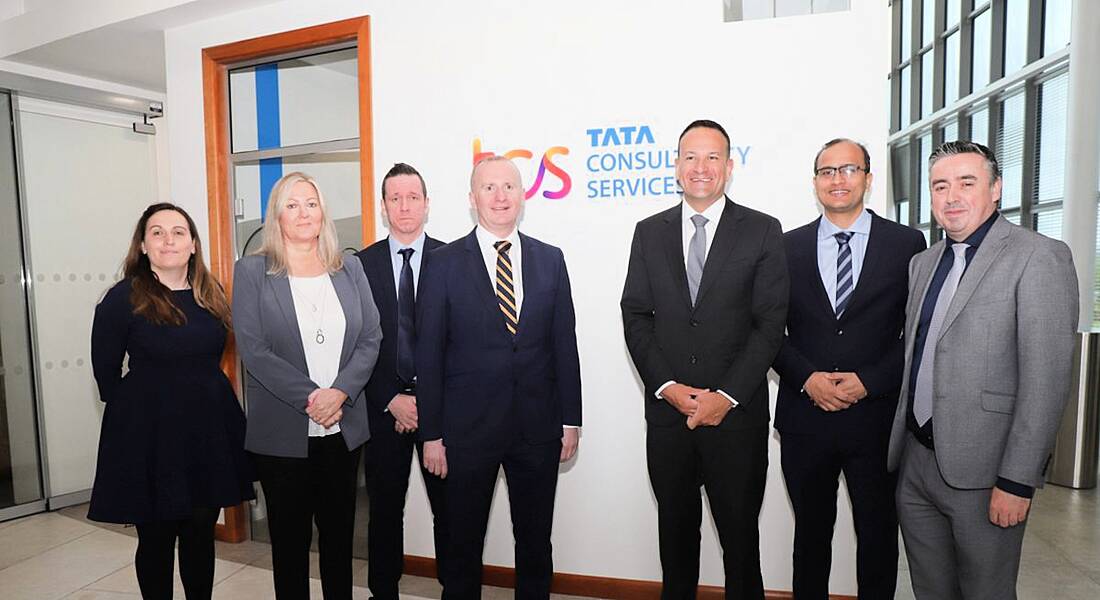 Seven people standing in a row at TCS in Letterkenny Donegal offices.