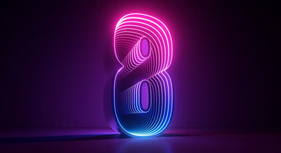 The number eight lit up in pink and purple and blue shades against a dark purple backdrop.