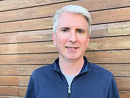 A man wearing a suit jacket over a white shirt. He is medtech professional Brian Callaghan of Viatris Global Device Development.