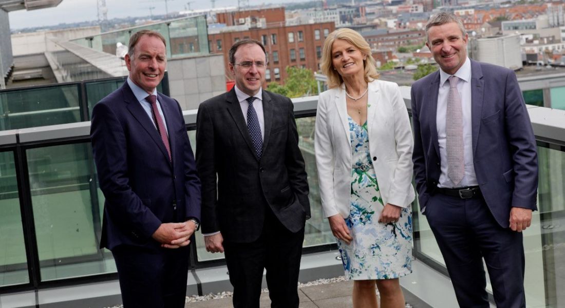 Paul Healy, chief executive of Skillnet Ireland; Minister of State at the Department of Enterprise, Trade and Employment, Robert Troy; IDA Ireland executive director, Mary Buckley; and Minister of State at the Department of Further and Higher Education, Niall Collins standing outdoors on a balcony.