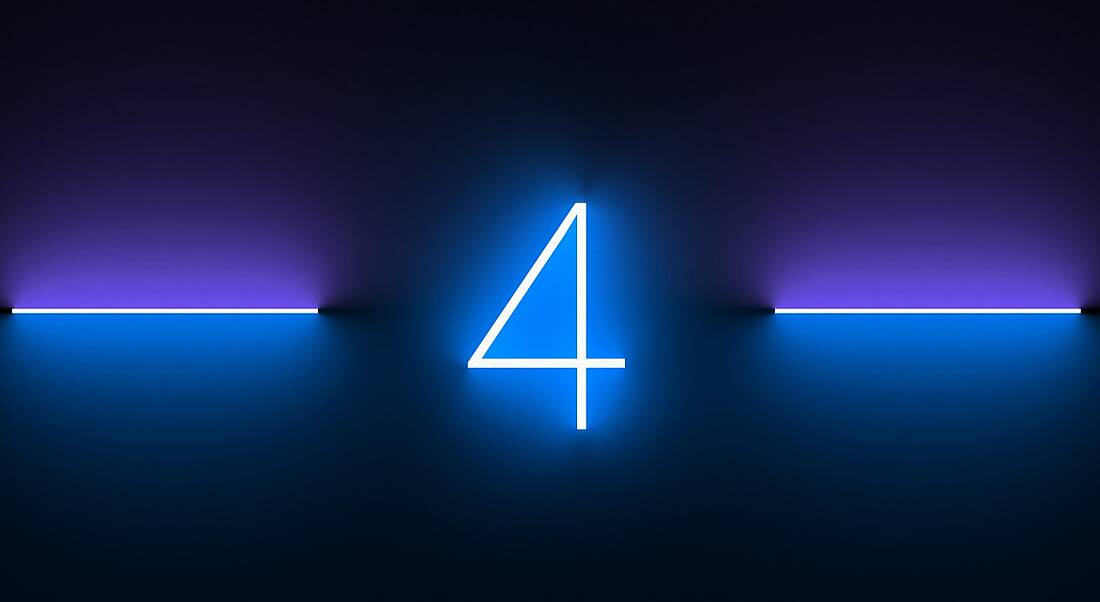 A blue neon light in the shape of a number four against a dark background.