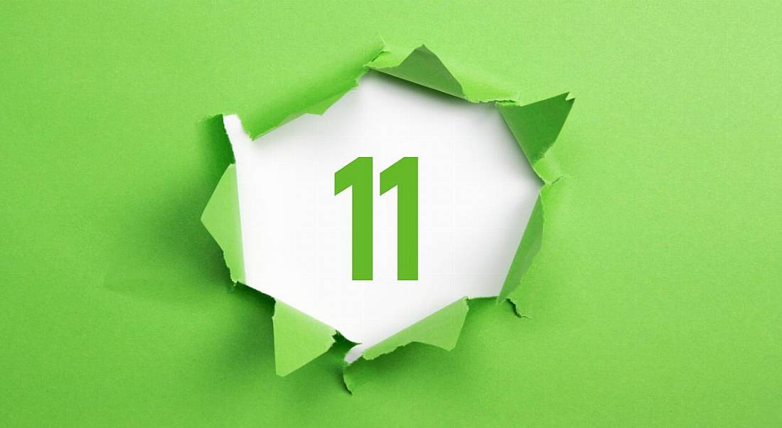 Number eleven in green on a white background with green paper ripped around it.